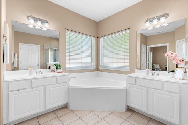 11926 Brightwood Dr, Montgomery, TX 77356 - bathroom with a garden tub, ensuite bathroom, a shower stall, tile patterned flooring, and a sink