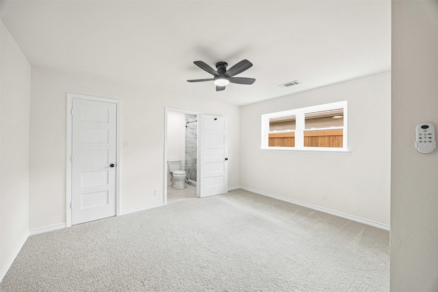 unfurnished bedroom featuring carpet floors, visible vents, and baseboards