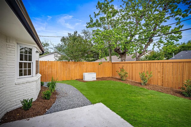 view of yard featuring a patio and a fenced backyard