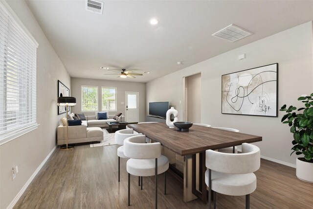 dining room featuring wood finished floors, baseboards, ceiling fan, and recessed lighting