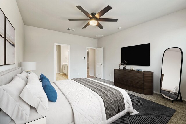 bedroom with light carpet, a ceiling fan, baseboards, and connected bathroom