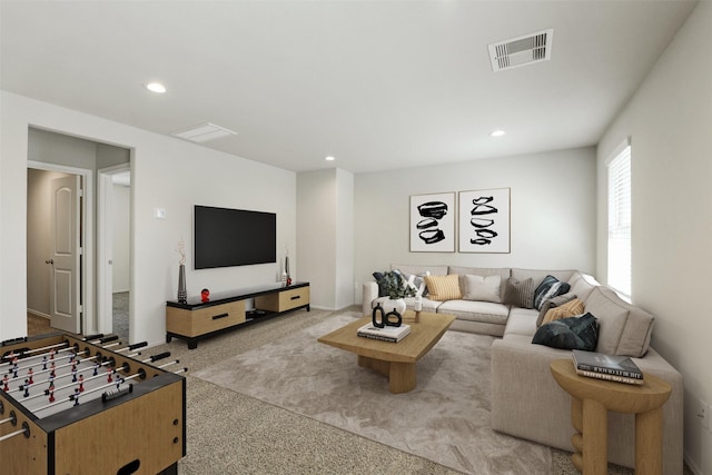 living room featuring light colored carpet and recessed lighting