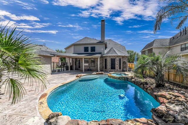 2226 Arrowwood Trl, Katy, TX 77494 - view of pool with a patio area, a fenced backyard, and a pool with connected hot tub