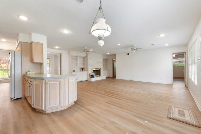 kitchen featuring recessed lighting, freestanding refrigerator, light wood-style floors, open floor plan, and ceiling fan