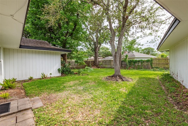 view of yard with a fenced backyard
