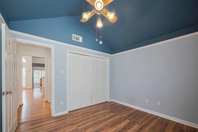 1904 Portsmouth St, Houston, TX 77098 - unfurnished bedroom with wood finished floors, a closet, lofted ceiling, and visible vents