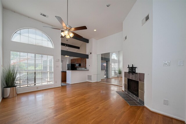 1904 Portsmouth St, Houston, TX 77098 - unfurnished living room with light wood-style floors, visible vents, and a ceiling fan