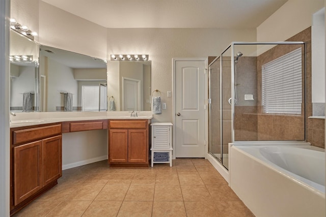 bathroom with a shower stall, tile patterned flooring, double vanity, and a garden tub
