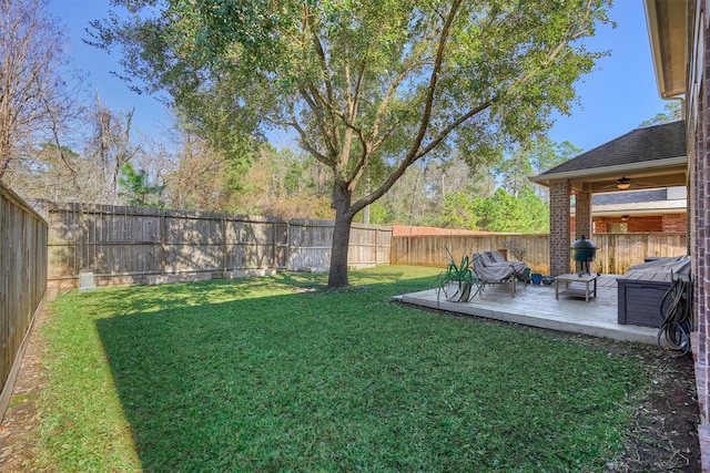 view of yard with a deck, a ceiling fan, and an outdoor hangout area