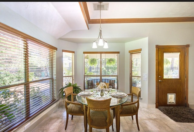 dining space with baseboards, lofted ceiling, and visible vents