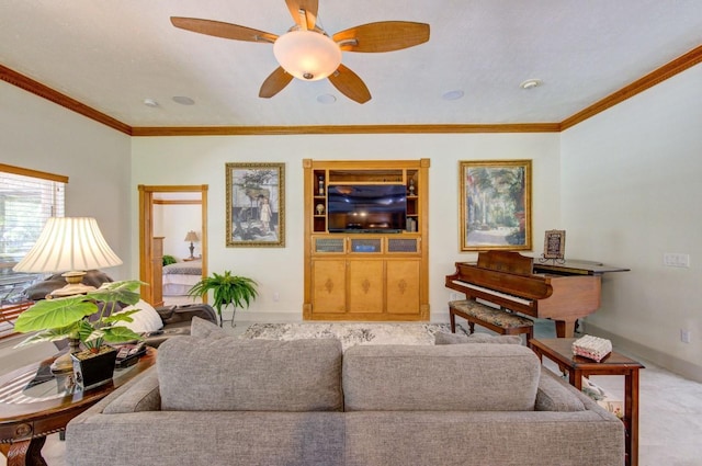 living room featuring baseboards, crown molding, and ceiling fan