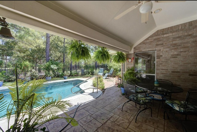 outdoor pool featuring a patio area, a fenced backyard, and a ceiling fan