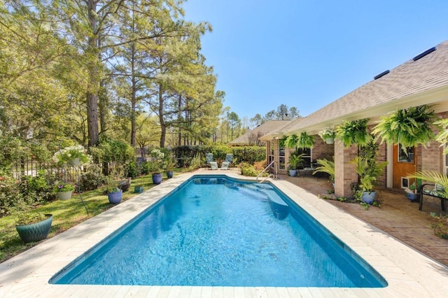 view of swimming pool with a fenced in pool, a patio area, and fence