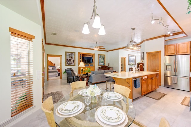 dining space featuring visible vents, ceiling fan with notable chandelier, and crown molding