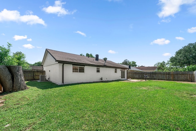1802 Winston Homestead St, Richmond, TX 77406 - rear view of property featuring a yard, a patio area, a fenced backyard, cooling unit, and brick siding
