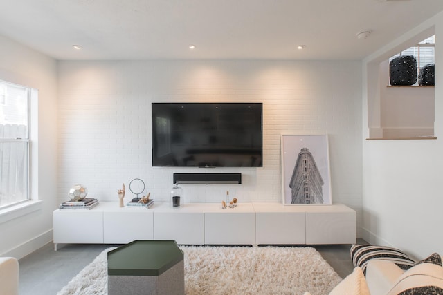 258 Sentry Maple Pl, The Woodlands, TX 77382 - living room with healthy amount of natural light and baseboards