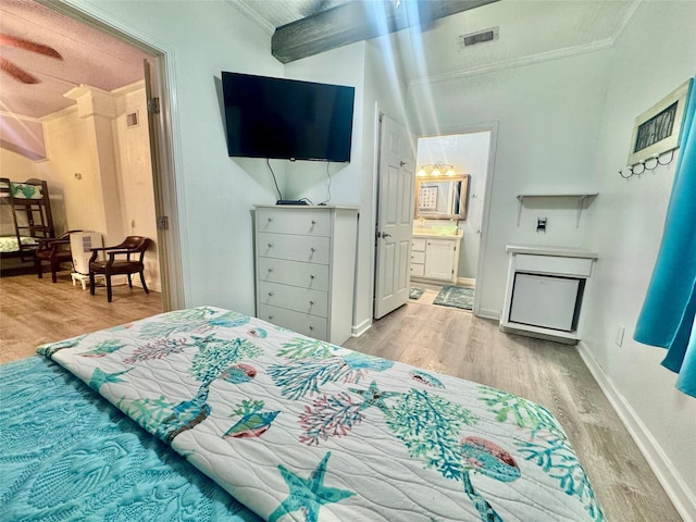 101 Saltgrass Ave, Surfside Beach, TX 77541 - bedroom featuring light wood-style floors, ornamental molding, and visible vents
