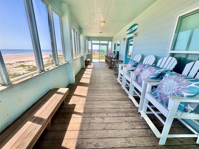 101 Saltgrass Ave, Surfside Beach, TX 77541 - sunroom / solarium featuring a beach view and a water view