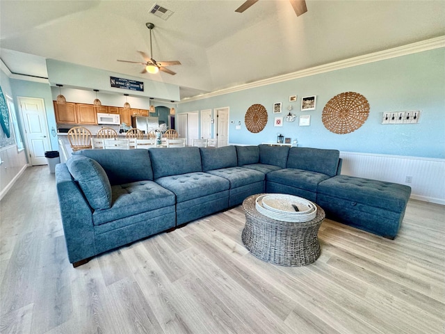 101 Saltgrass Ave, Surfside Beach, TX 77541 - living room with light wood-style floors, visible vents, a ceiling fan, and crown molding