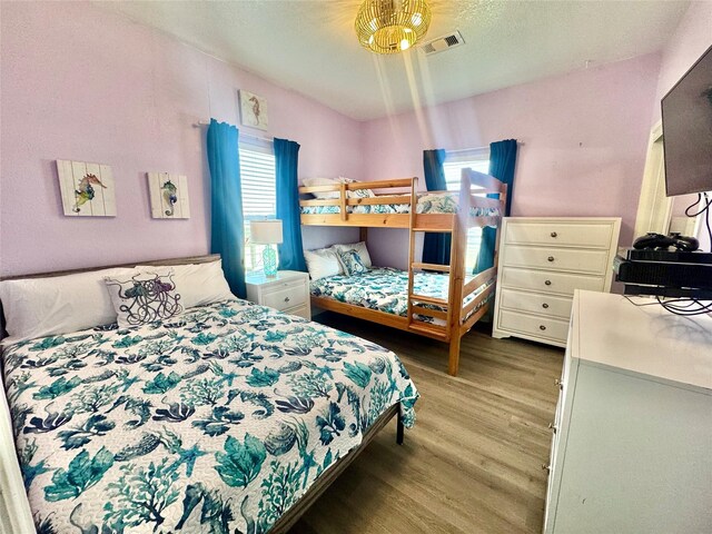 101 Saltgrass Ave, Surfside Beach, TX 77541 - bedroom featuring wood finished floors and visible vents