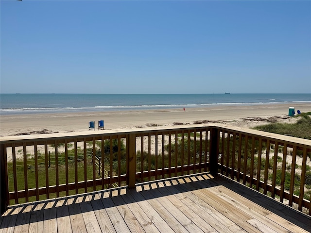 101 Saltgrass Ave, Surfside Beach, TX 77541 - wooden deck with a water view and a beach view