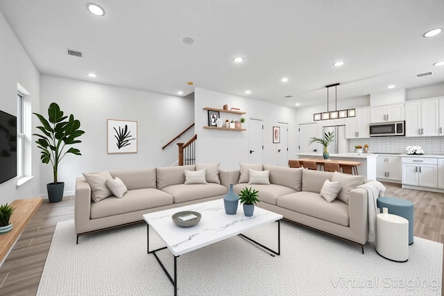 2015 Brackenridge St Unit A, Houston, TX 77026 - living room with light wood-type flooring and recessed lighting