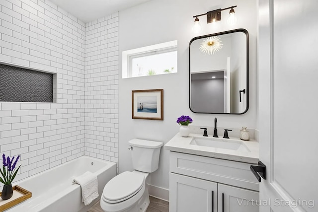 2015 Brackenridge St Unit A, Houston, TX 77026 - full bathroom with vanity, toilet, baseboards, and washtub / shower combination