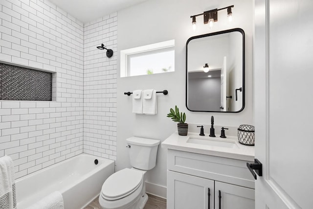 2015 Brackenridge St Unit A, Houston, TX 77026 - full bath with vanity, toilet, shower / bath combination, wood finished floors, and baseboards