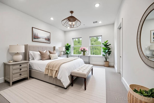 2015 Brackenridge St Unit A, Houston, TX 77026 - bedroom with light carpet, baseboards, and recessed lighting