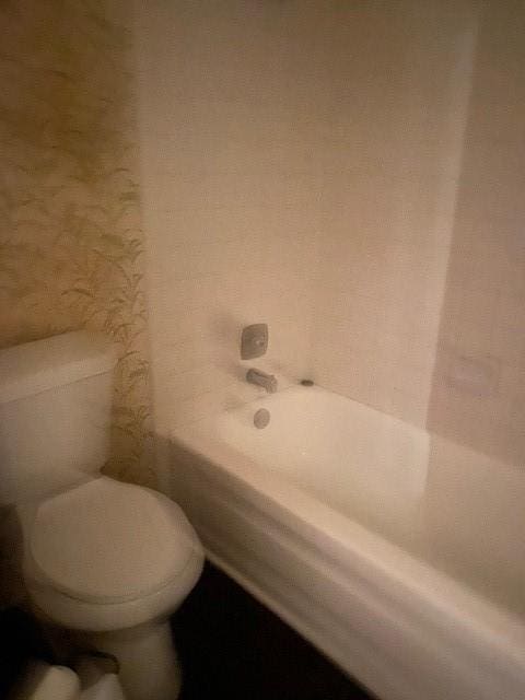 12207 Mckamy Dr, Houston, TX 77067 - full bathroom featuring toilet and washtub / shower combination