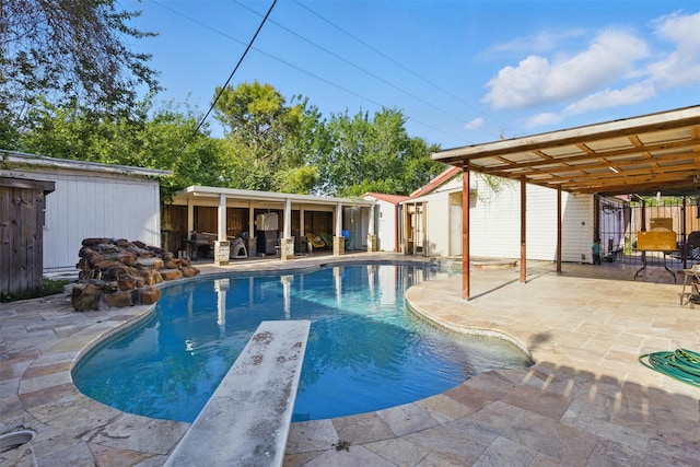 6022 Downwood Forest Dr, Houston, TX 77088 - pool with a patio area, a diving board, and an outbuilding