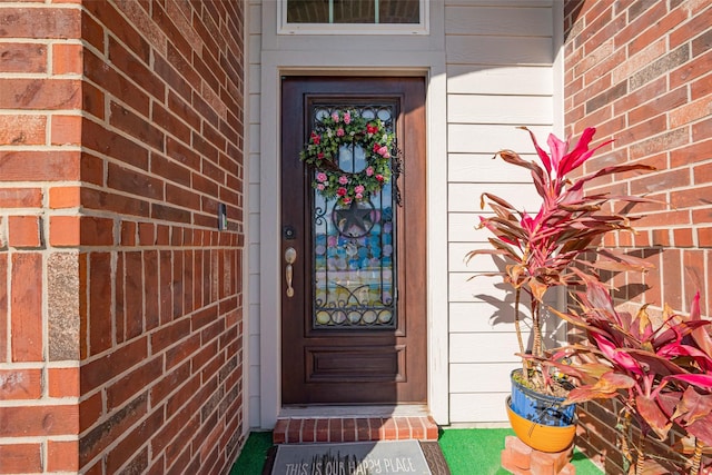 5819 Southern Rose Ln, Rosenberg, TX 77469 - view of exterior entry featuring brick siding