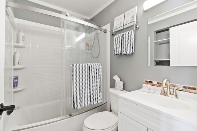 full bathroom with toilet, enclosed tub / shower combo, and vanity