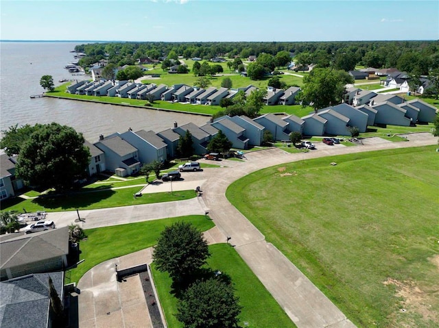 drone / aerial view with a residential view and a water view