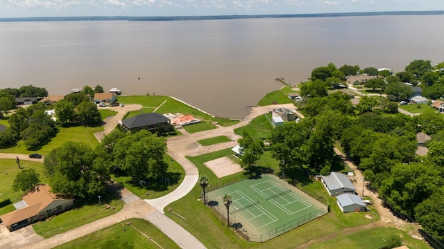 birds eye view of property with a water view and a residential view