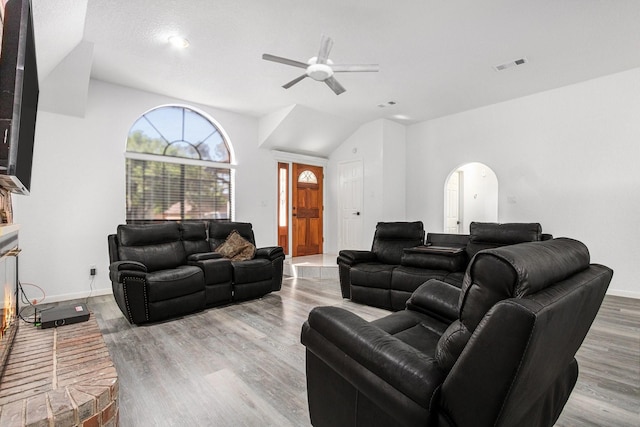 39 Alexander Ct, Angleton, TX 77515 - living room featuring lofted ceiling, ceiling fan, wood finished floors, and baseboards
