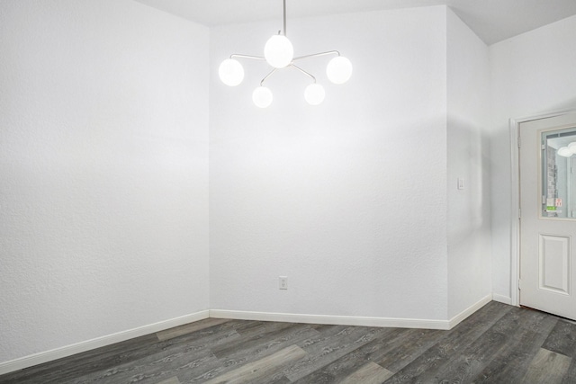 39 Alexander Ct, Angleton, TX 77515 - unfurnished dining area featuring dark wood-style flooring, a chandelier, and baseboards