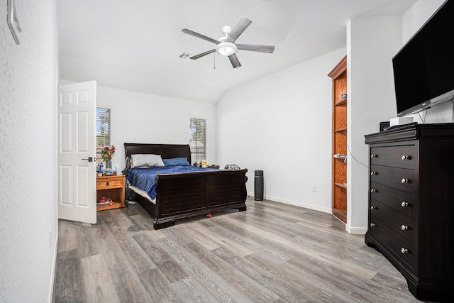 39 Alexander Ct, Angleton, TX 77515 - bedroom with wood finished floors, lofted ceiling, ceiling fan, and baseboards