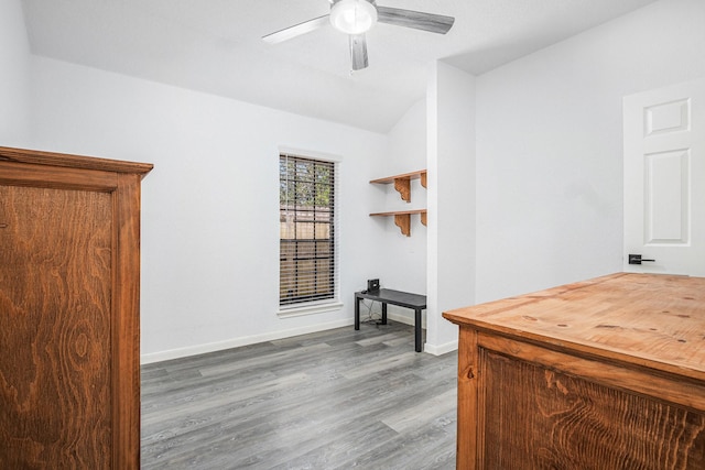 39 Alexander Ct, Angleton, TX 77515 - home office featuring wood finished floors, lofted ceiling, ceiling fan, and baseboards