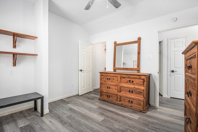 39 Alexander Ct, Angleton, TX 77515 - bedroom with vaulted ceiling, wood finished floors, baseboards, and ceiling fan