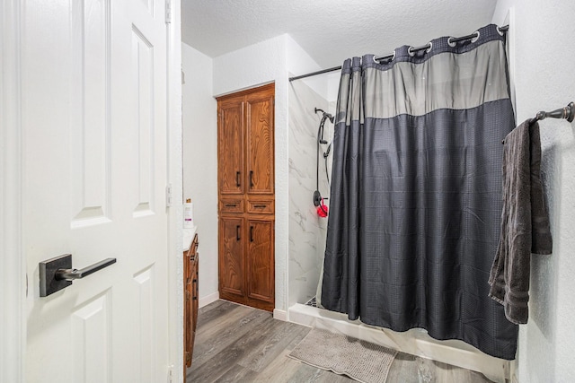 39 Alexander Ct, Angleton, TX 77515 - full bathroom with wood finished floors, curtained shower, and vanity