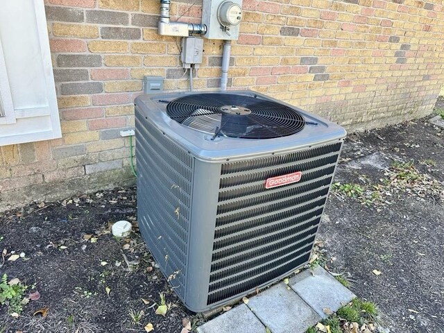 exterior details featuring electric meter and cooling unit