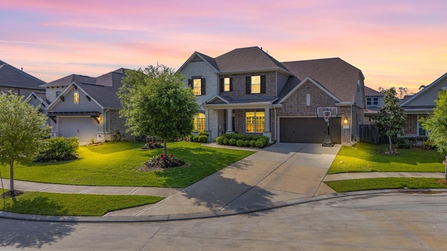 view of front of home featuring brick siding, roof with shingles, concrete driveway, and a lawn