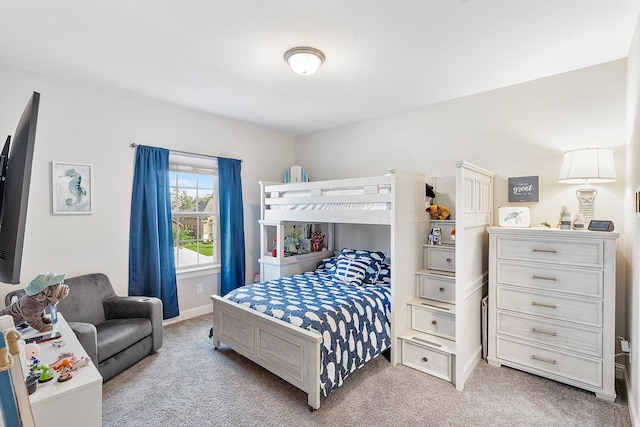 bedroom featuring light colored carpet