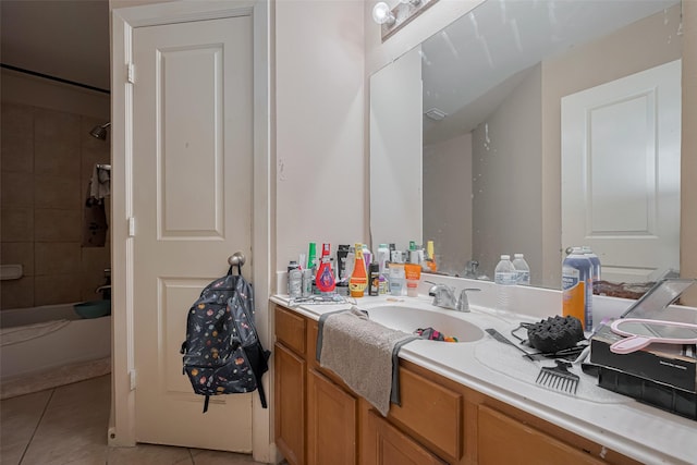full bathroom featuring vanity, tile patterned flooring, and bathtub / shower combination