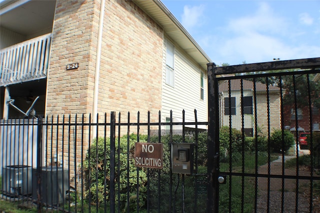 2300 Augusta Dr Unit 36, Houston, TX 77057 - view of property exterior with brick siding, fence, and a gate