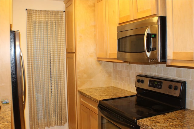 2300 Augusta Dr Unit 36, Houston, TX 77057 - kitchen featuring tasteful backsplash, light brown cabinets, light stone countertops, and stainless steel appliances