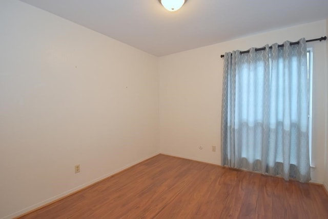 2300 Augusta Dr Unit 36, Houston, TX 77057 - unfurnished room featuring baseboards and wood finished floors