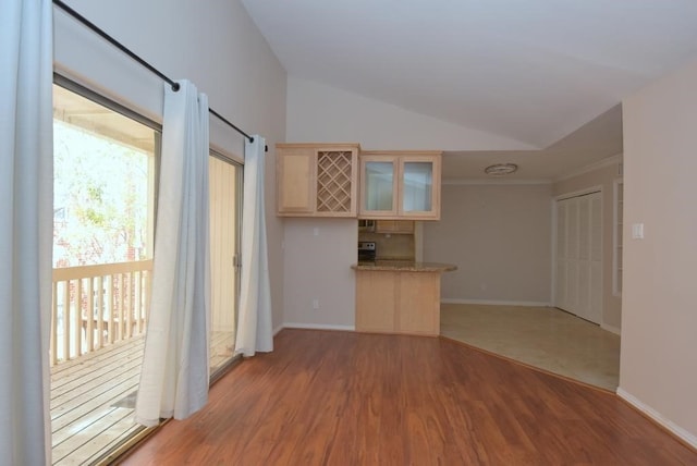 2300 Augusta Dr Unit 36, Houston, TX 77057 - unfurnished living room with ornamental molding, light wood-style flooring, baseboards, and lofted ceiling