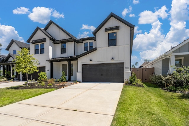 16958 Chapel Knox Dr, Humble, TX 77346 - modern farmhouse featuring board and batten siding, a front lawn, a garage, and concrete driveway
